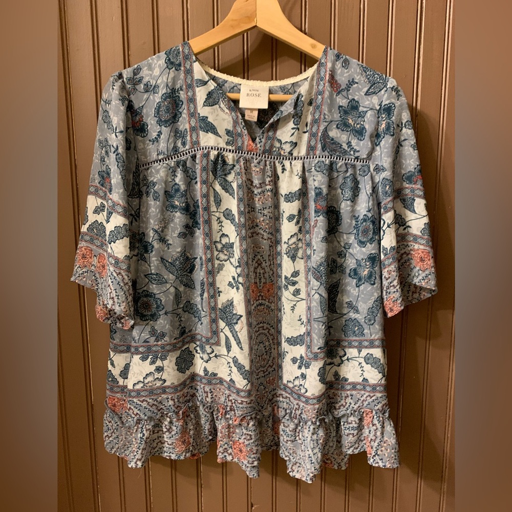 Floral short sleeve v neck Blouse in Blue and Mauve (orange). Ruffle bottom